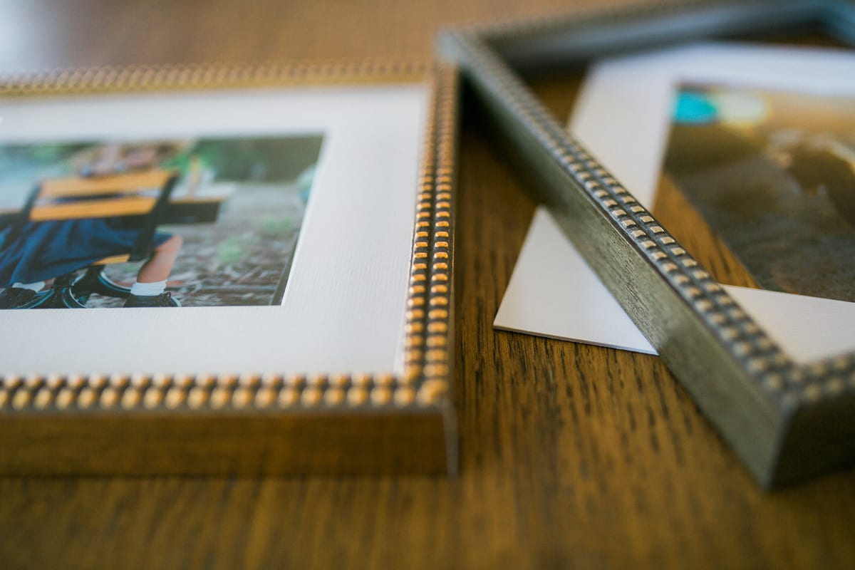Close-up of beaded gold and silver picture frames