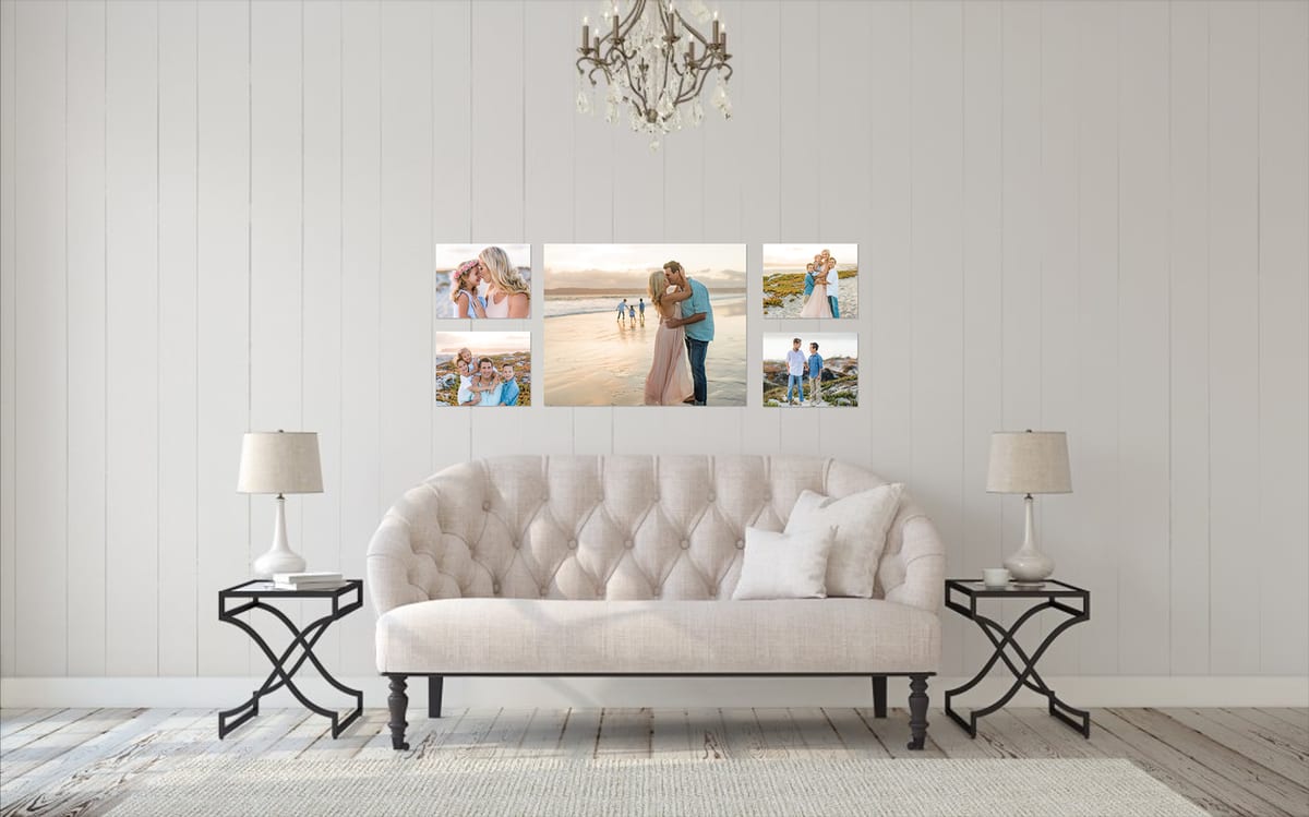 Canvas wall gallery of beach family portraits above a tufted sofa