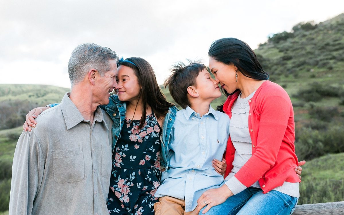 San Diego Family Lifestyle Photographer | Fun family portrait session with green hills and golden light